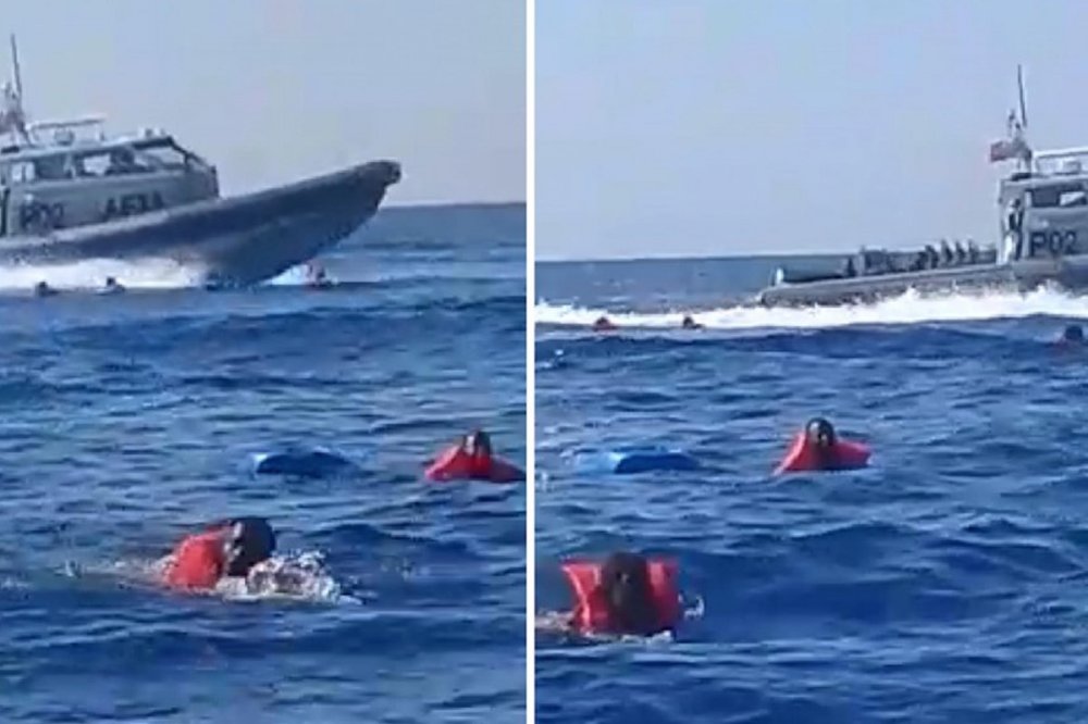 Nave militare maltese sfreccia fra migranti in acqua